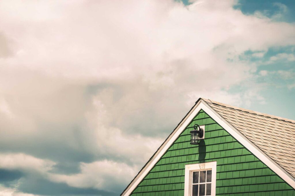 Green house with wooden shingles