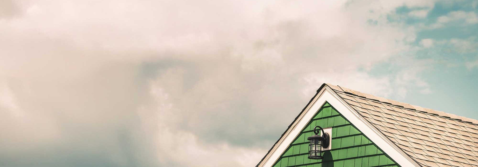 Green house with wooden shingles